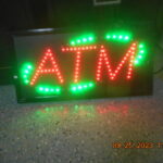 RED ATM with Green Swoops